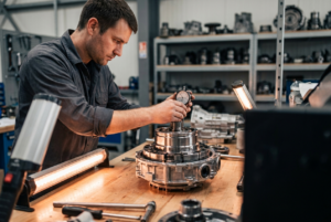 Technician inspecting a remanufactured transmission at Steel Bay